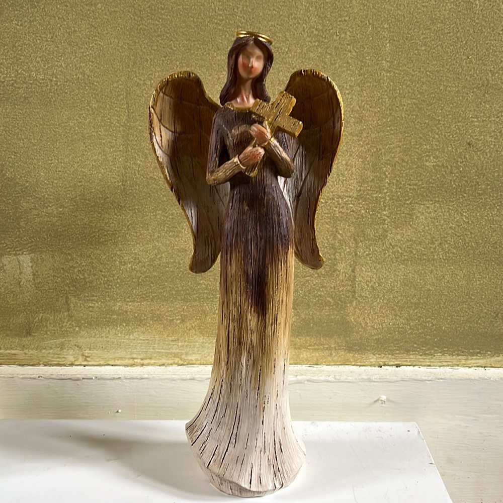 Angel holding a cross